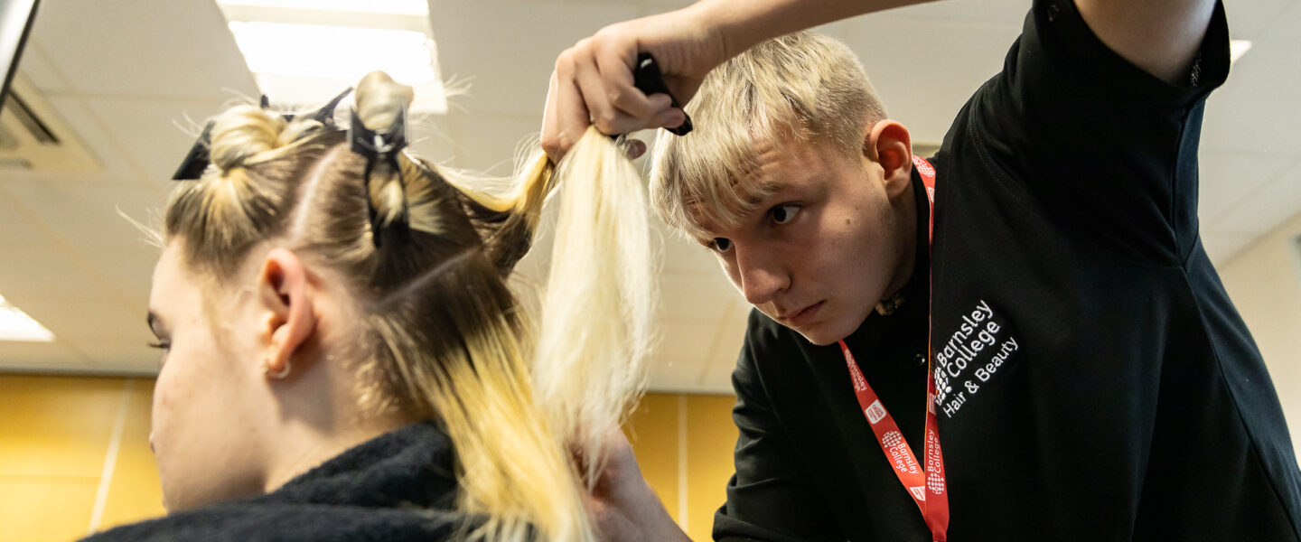 Student cutting hair