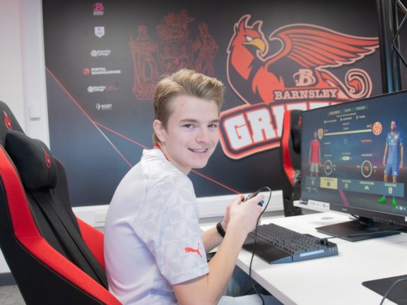 Caleb Beardsall playing FIFA in the College’s state-of-the-art Esports classroom.