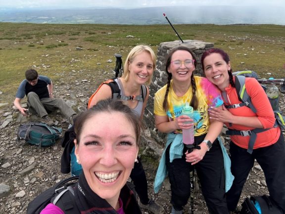 Tracey Lomas, Melanie Priestley, Rachel Holmes and Emily Morriss at the summit of Ingleborough.