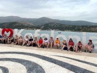 Staff and students in front of the I Love Kefalonia sign in Argostoli