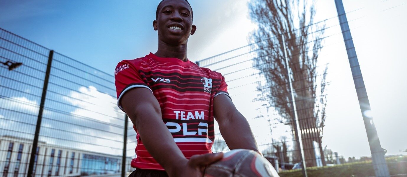 Kuzivakwashe Mazani holding rugby ball