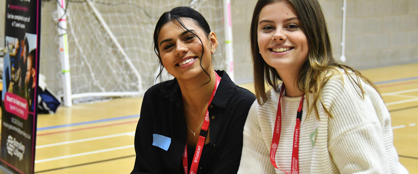 Business students smiling at Employer networking event