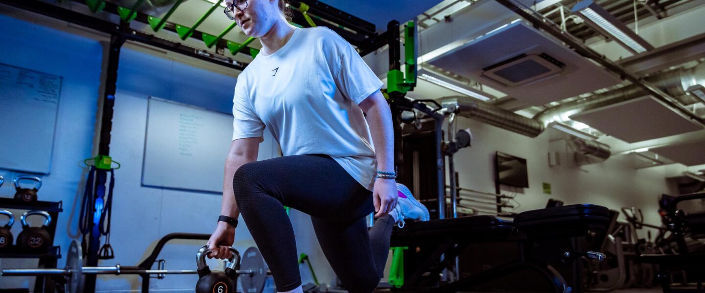 Woman doing weights in gym