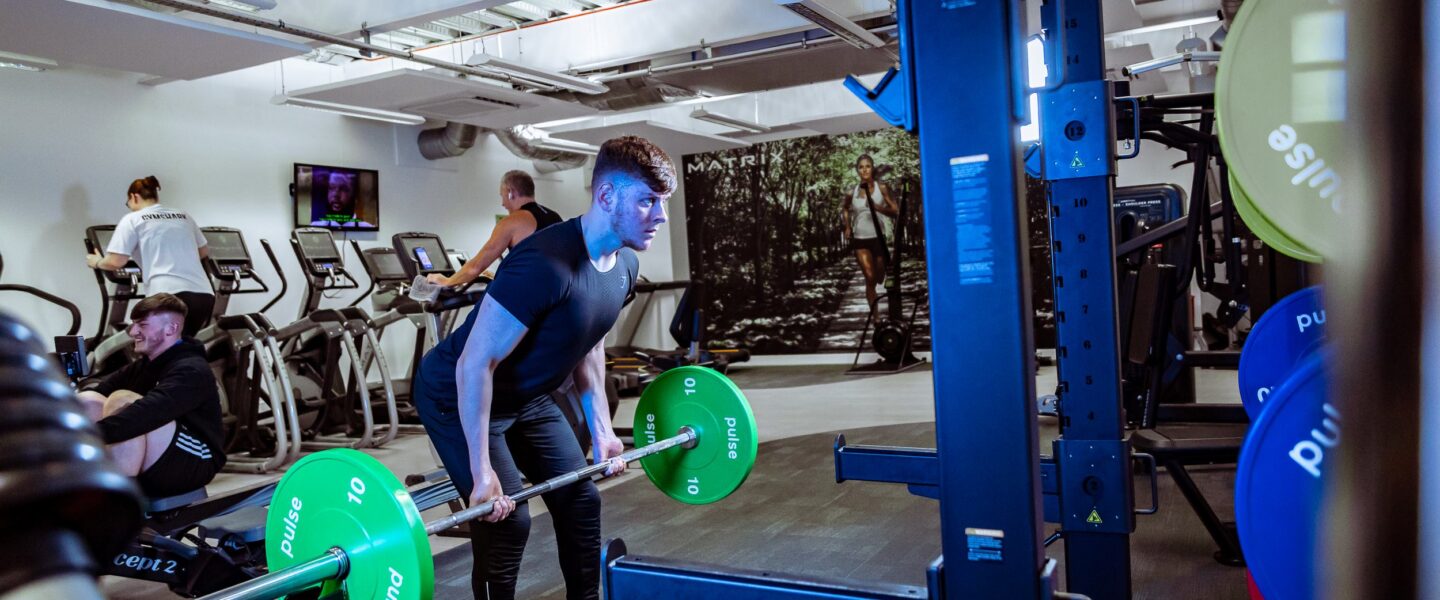 Man lifting weights in gym