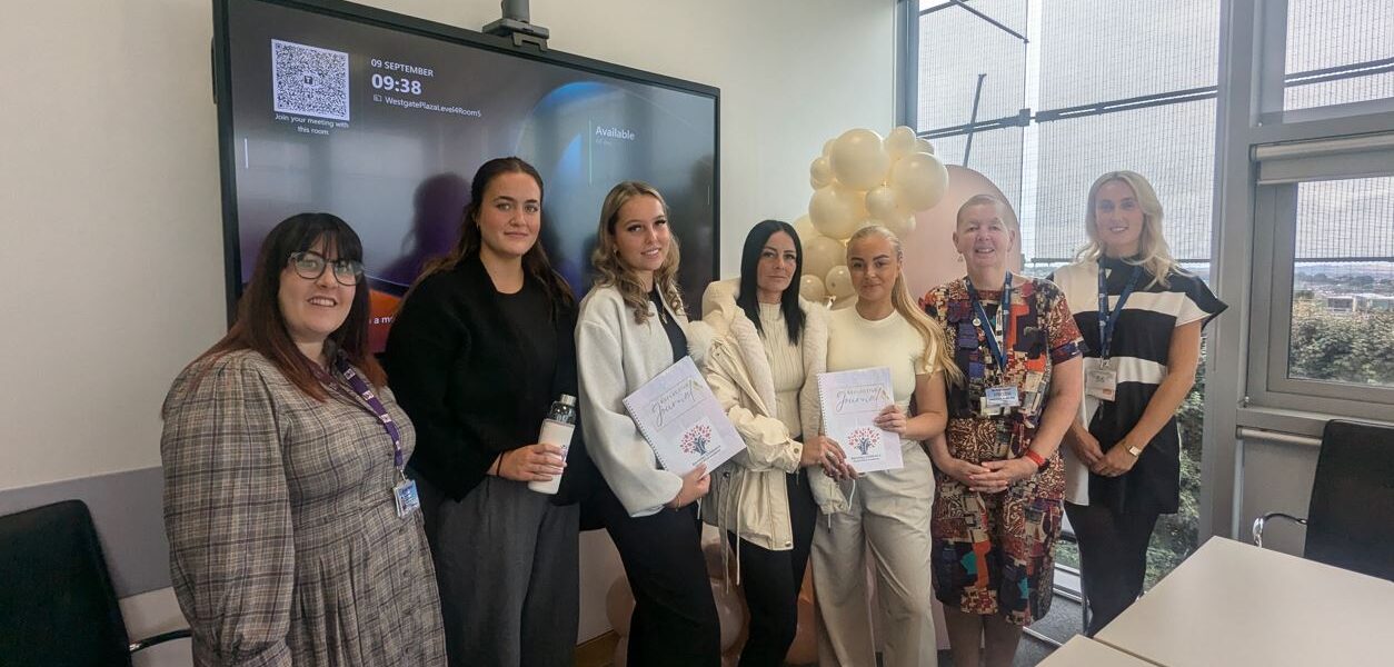 Abigail Bates (centre) with the other three alumni alongside Barnsley Council Social Worker and College staff